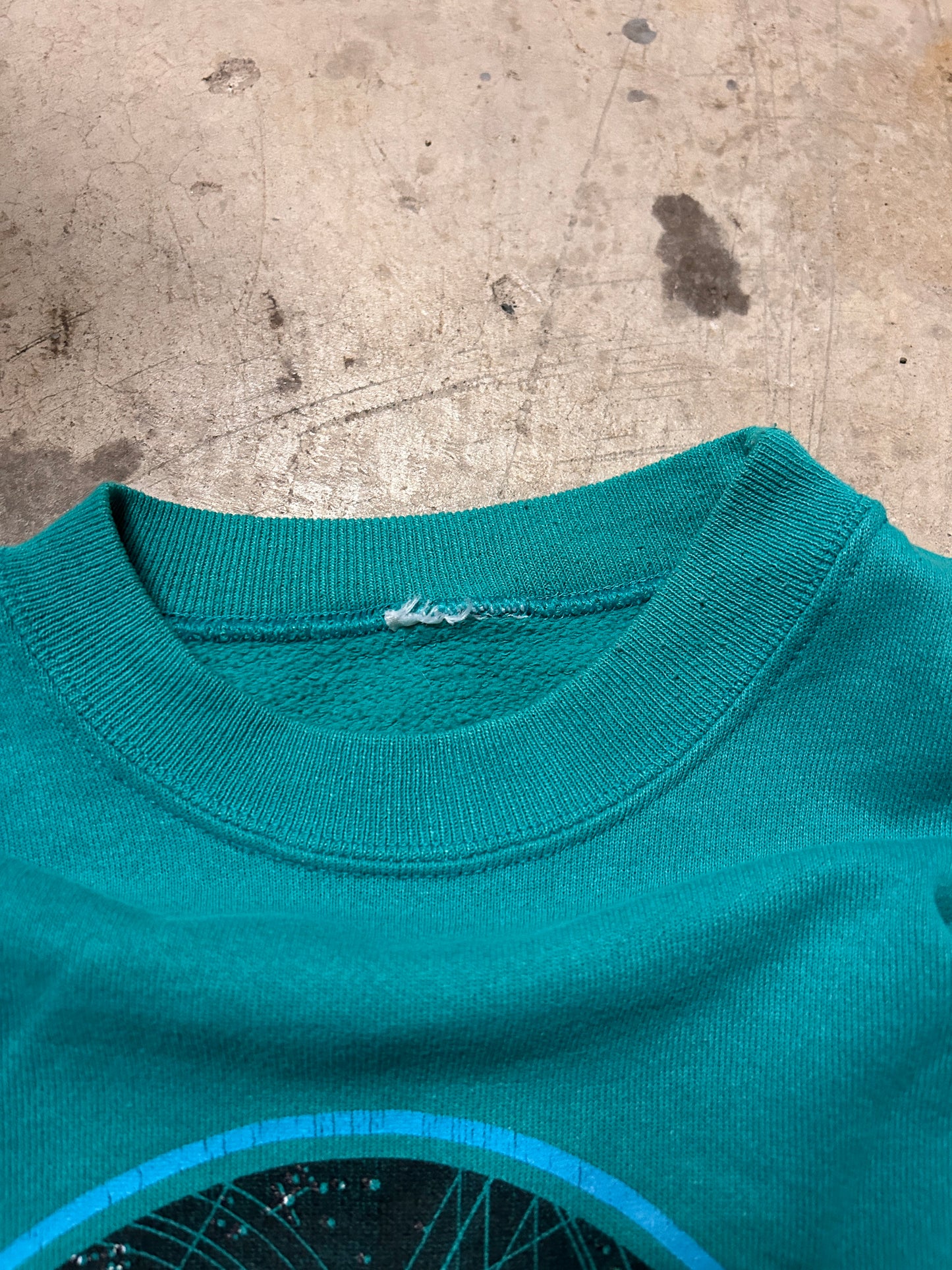 Vintage 1986 Aeire Designs Turquoise Space Dolphins Crewneck (L)